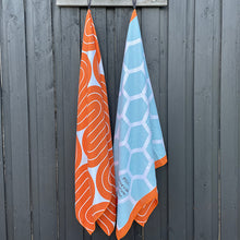 Load image into Gallery viewer, The Desert and Desert XXL sand-free beach towels hanging together.
