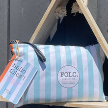 Load image into Gallery viewer, The Desert sand-free beach towel packed inside its reusable travel pouch.