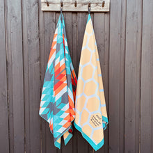 Load image into Gallery viewer, The Reef sand-free beach towels hanging together.