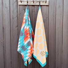 Load image into Gallery viewer, The Gum sand-free beach towels hanging together.
