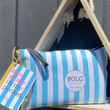 Load image into Gallery viewer, The Wattle sand-free beach towel packed inside its reusable travel pouch.
