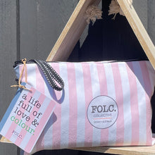 Load image into Gallery viewer, The Gum sand-free beach towel packed inside its reusable travel pouch.
